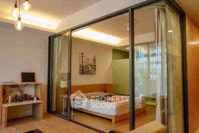 Modern bedroom with glass walls and cozy lighting in a stylish apartment.