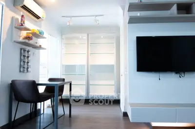 Modern living room with wall-mounted TV and stylish furniture