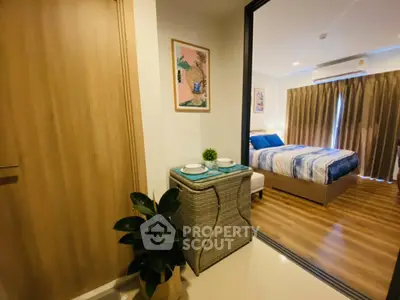Modern bedroom with stylish decor and wooden flooring in cozy apartment