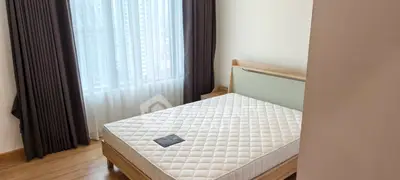 Modern bedroom with large window and natural light