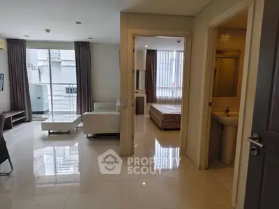 Modern apartment interior with living room, bedroom, and bathroom, featuring sleek design and natural light.