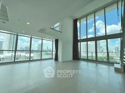 Spacious corner unit with floor-to-ceiling windows and stunning city views.