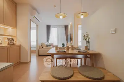 Modern open-plan living and dining area with stylish decor and natural light.