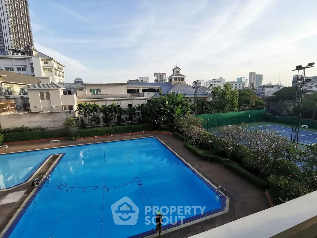 Luxurious urban apartment complex with pool and tennis court view
