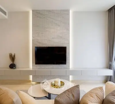 Modern living room with sleek TV setup and elegant decor