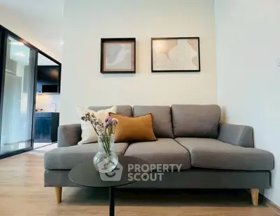 Modern living room with stylish gray sofa and elegant decor