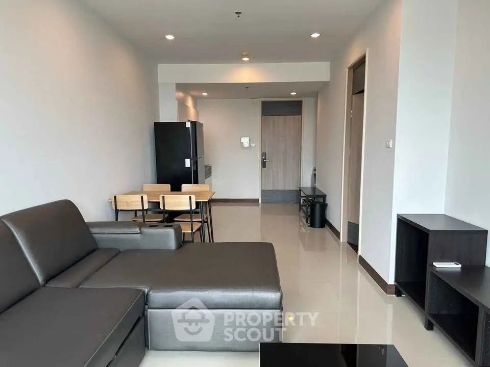 Modern living room with sleek furniture and open layout in a contemporary apartment.