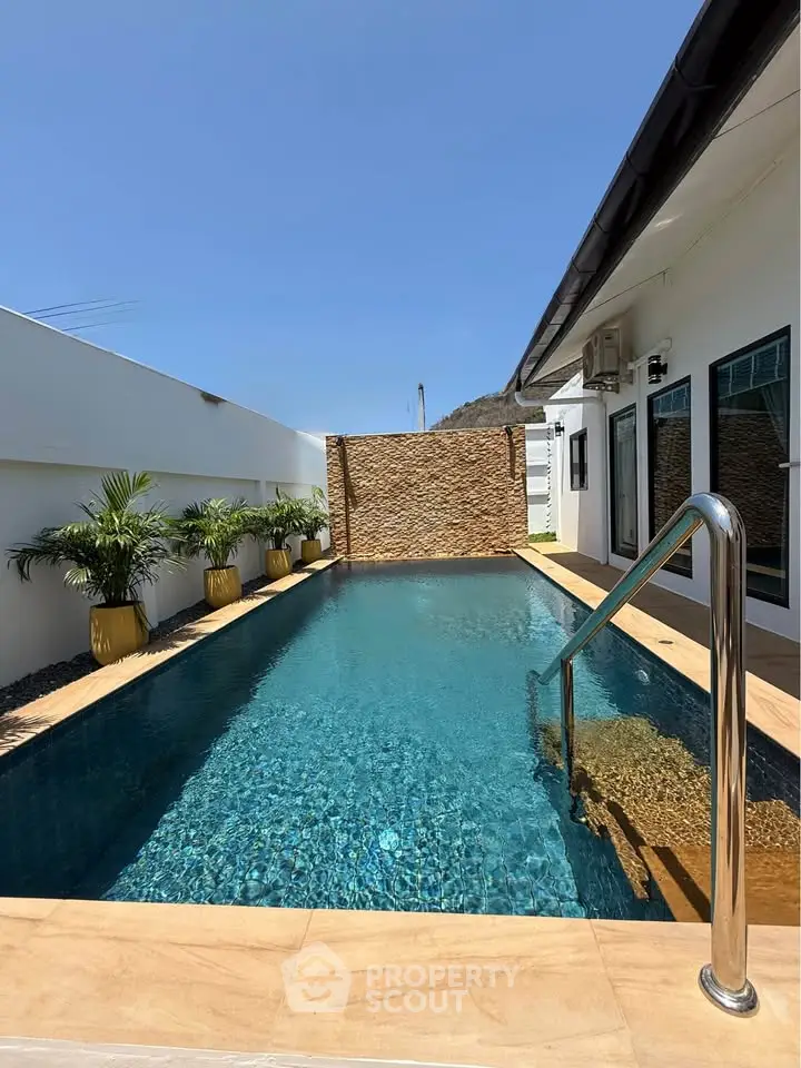 Luxurious private pool with modern design and serene ambiance, perfect for relaxation and entertainment.