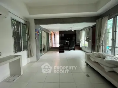 Spacious modern living room with large windows and sleek design