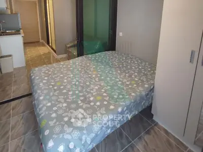 Cozy studio apartment with modern decor and tiled flooring