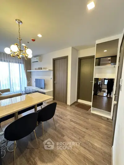 Modern living room with elegant chandelier and stylish furniture