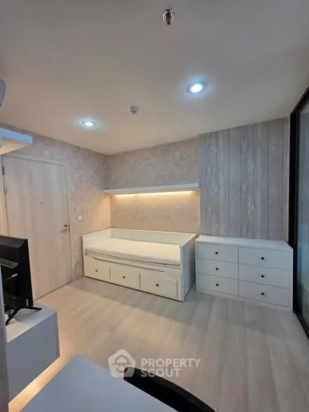 Modern minimalist bedroom with built-in storage and sleek design