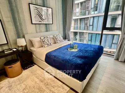 Luxurious modern bedroom with stylish decor and large window view