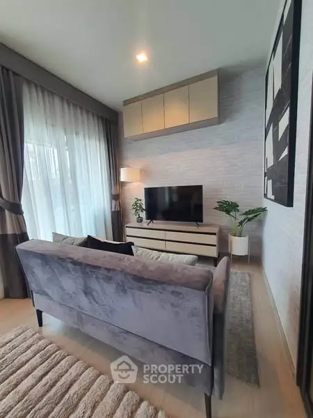 Modern living room with stylish decor and large window