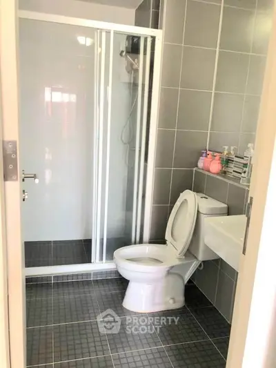 Modern bathroom with sleek shower and tiled walls