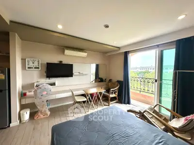 Modern studio apartment with balcony and stylish interior design
