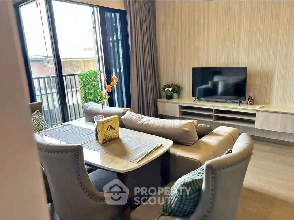Stylish living room with modern decor and natural light, perfect for relaxation and entertainment.