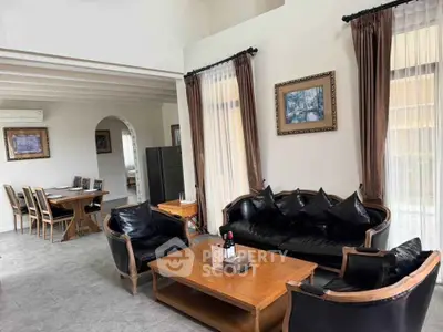 Elegant living room with classic furniture and dining area in open layout