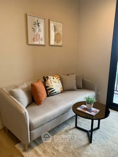 Cozy living room with modern sofa and stylish decor in a bright apartment.