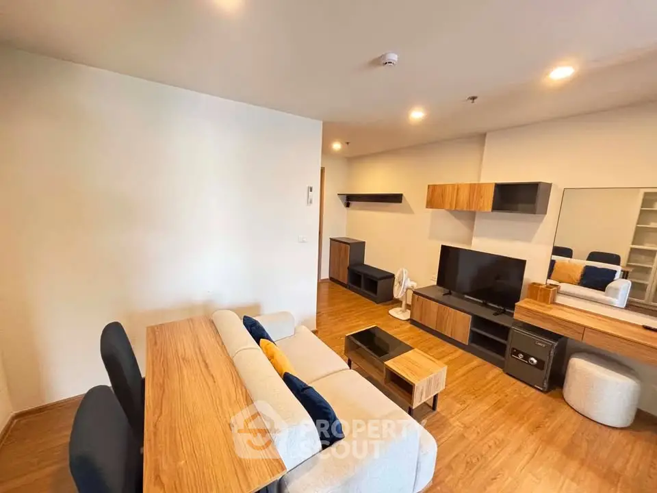 Modern living room with stylish wooden furniture and cozy seating area