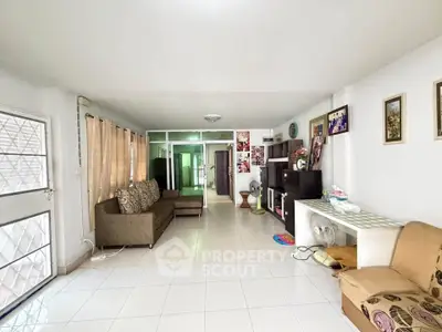 Spacious living room with modern decor and ample natural light
