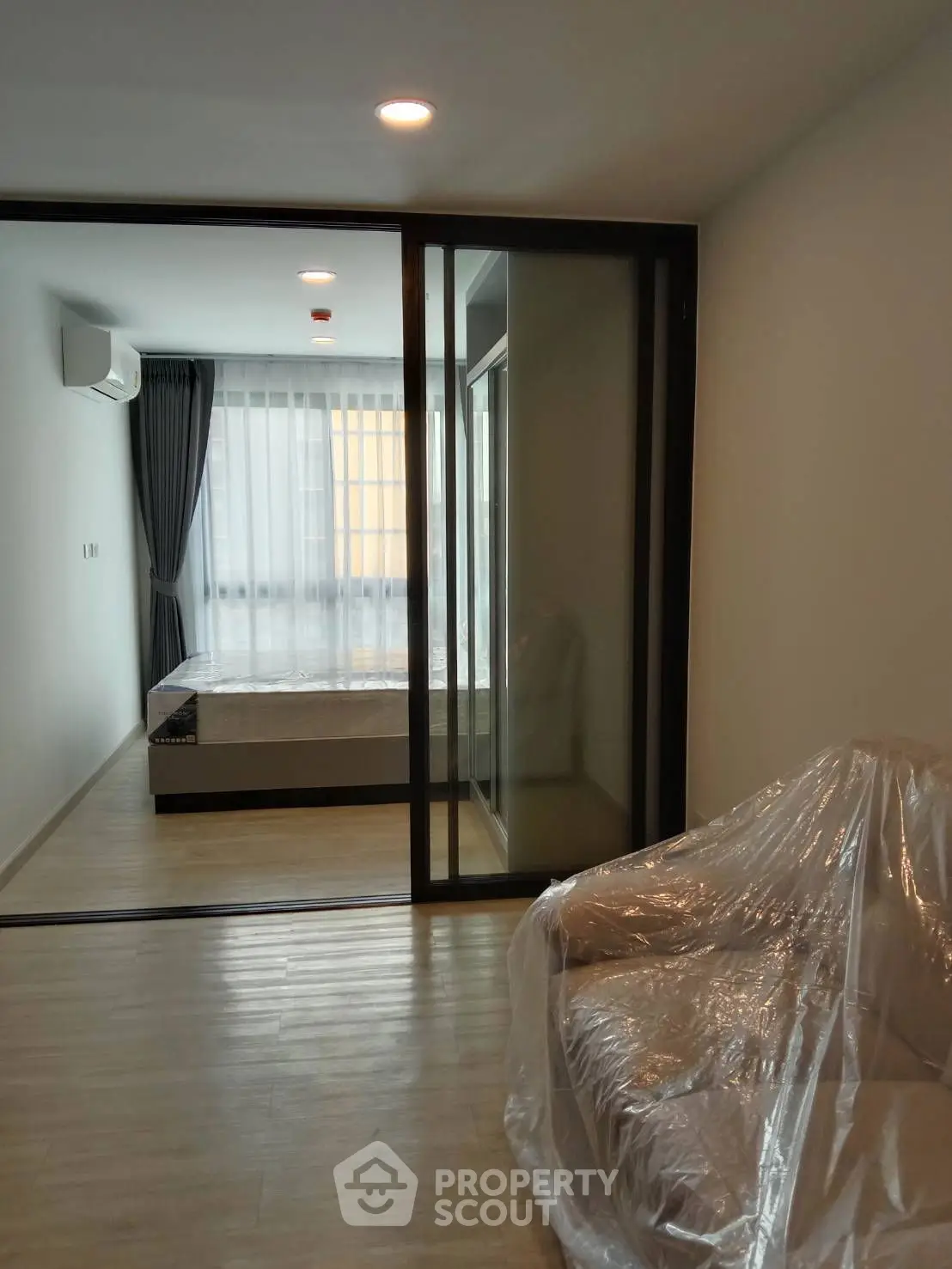 Modern bedroom with sleek design and large windows for natural light