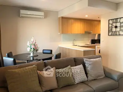 Modern living room with open kitchen and stylish decor