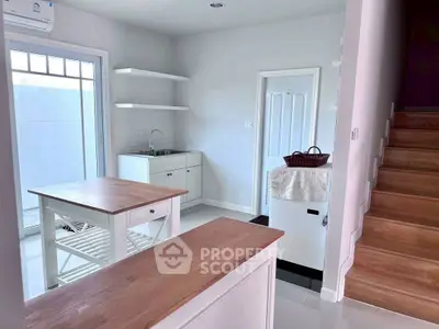 Charming kitchen with open layout and wooden accents, perfect for modern living.