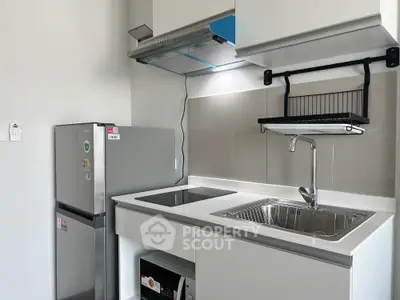 Modern kitchen with sleek appliances and minimalist design