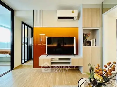 Modern living room with stylish TV setup and air conditioning