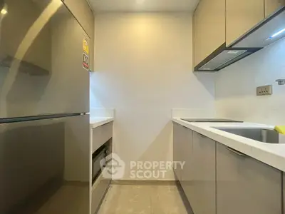 Modern kitchen with sleek cabinets and stainless steel appliances