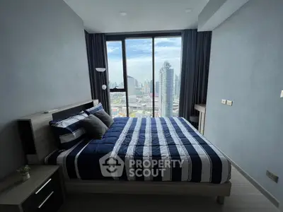 Modern bedroom with stunning city view and stylish decor