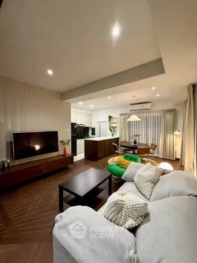 Spacious modern living room with open kitchen and stylish decor