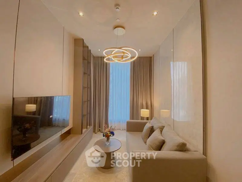 Modern living room with elegant lighting and cozy seating area.