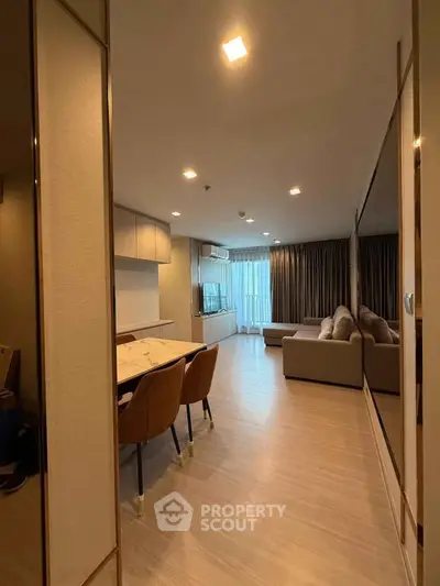 Spacious modern living room with elegant decor and ample natural light