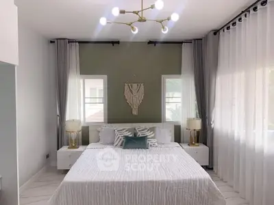 Elegant bedroom with modern decor and natural light