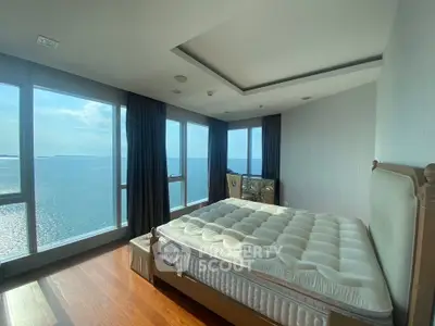 Luxurious bedroom with stunning ocean view and large windows