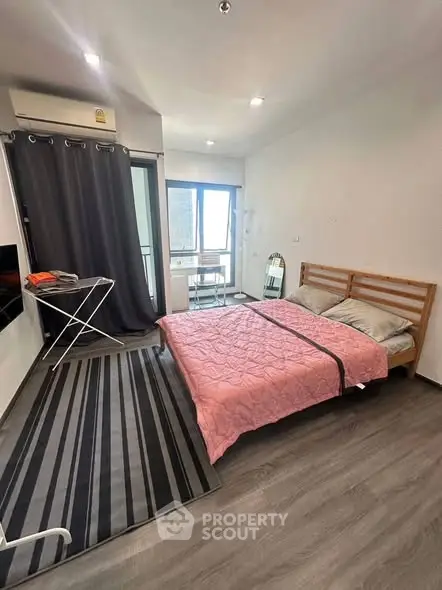 Modern bedroom with balcony access and stylish decor