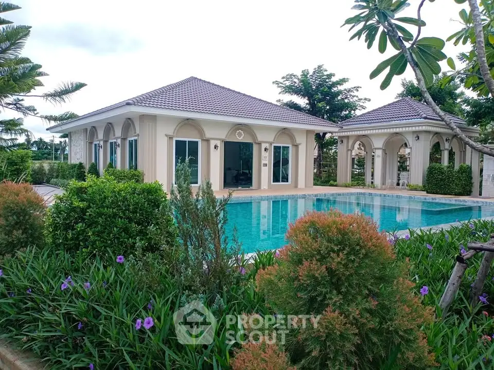 Luxurious villa with stunning pool and lush garden, perfect for serene living.