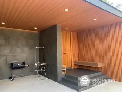 Modern exterior entrance with sleek wooden paneling and minimalist design