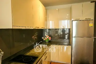 Modern kitchen with sleek cabinets and stainless steel appliances