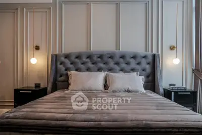 Luxurious bedroom with plush bedding and elegant lighting