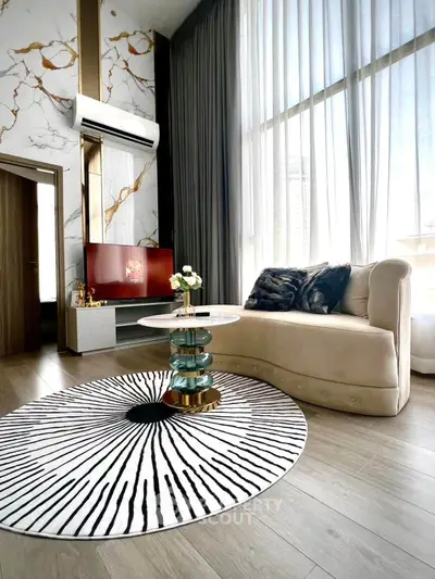Luxurious modern living room with high ceilings, elegant decor, and large windows for natural light.