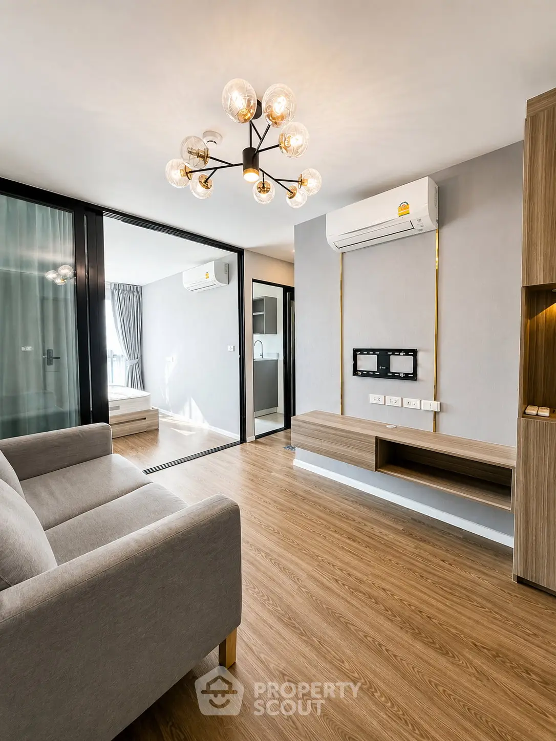 Modern living room with elegant lighting and sleek wooden flooring