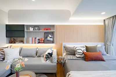 Modern bedroom with stylish decor and cozy seating area