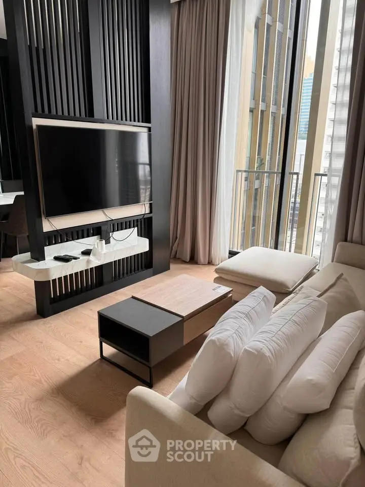 Luxurious modern living room with floor-to-ceiling windows and sleek decor