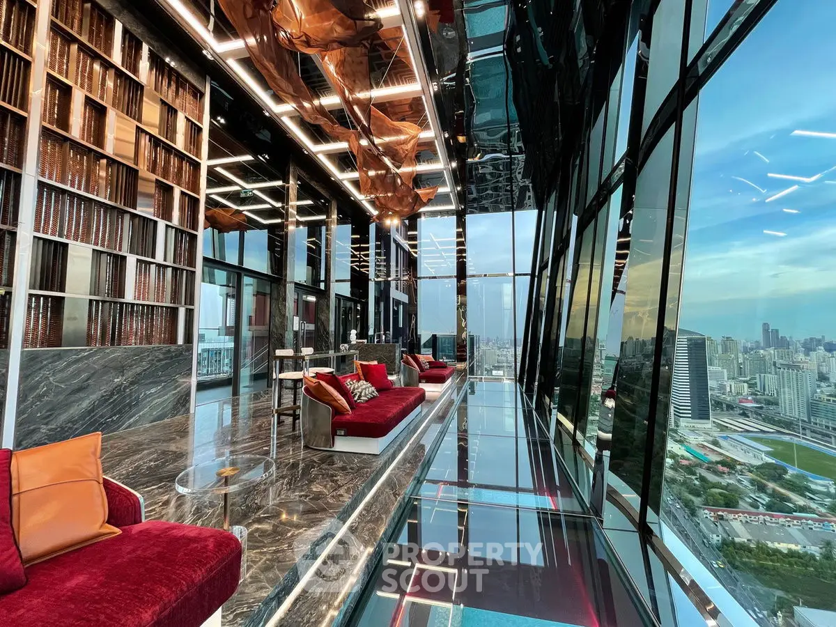 Luxurious high-rise living room with panoramic city views and modern design.