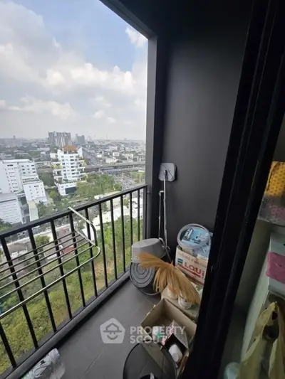 Cozy balcony with city view, perfect for relaxation and enjoying urban scenery.
