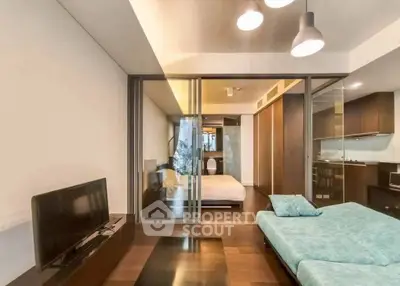 Modern studio apartment with open layout and stylish furnishings