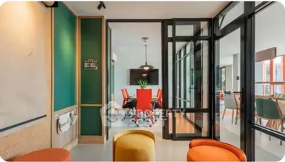 Modern office space with vibrant decor and glass partitions